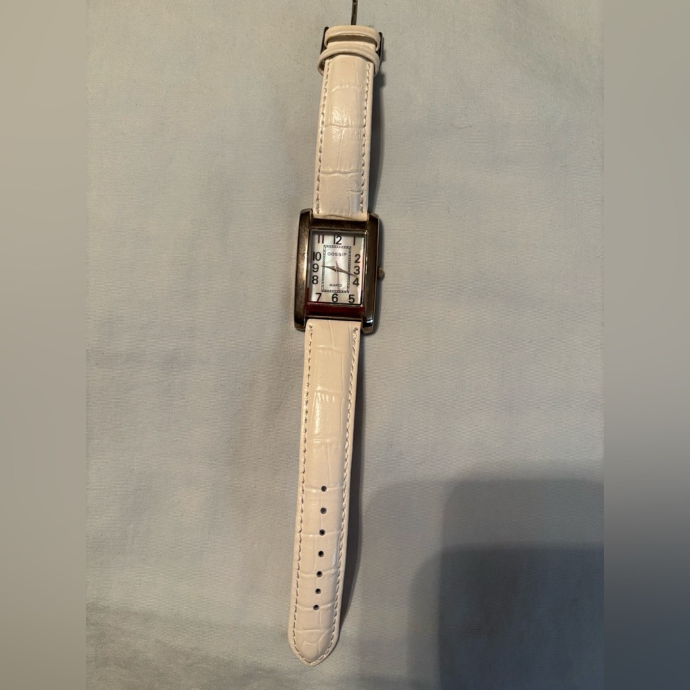 Brand new white watch with mother-of-pearl face.